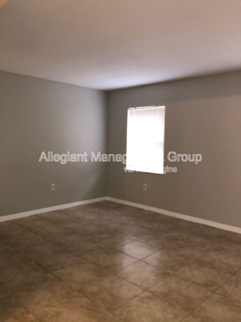 Spacious 3/2 Home In Poinciana With 2 Car garage & Screened Porch For Rent! property image