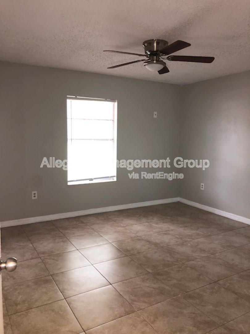 Spacious 3/2 Home In Poinciana With 2 Car garage & Screened Porch For Rent! property image