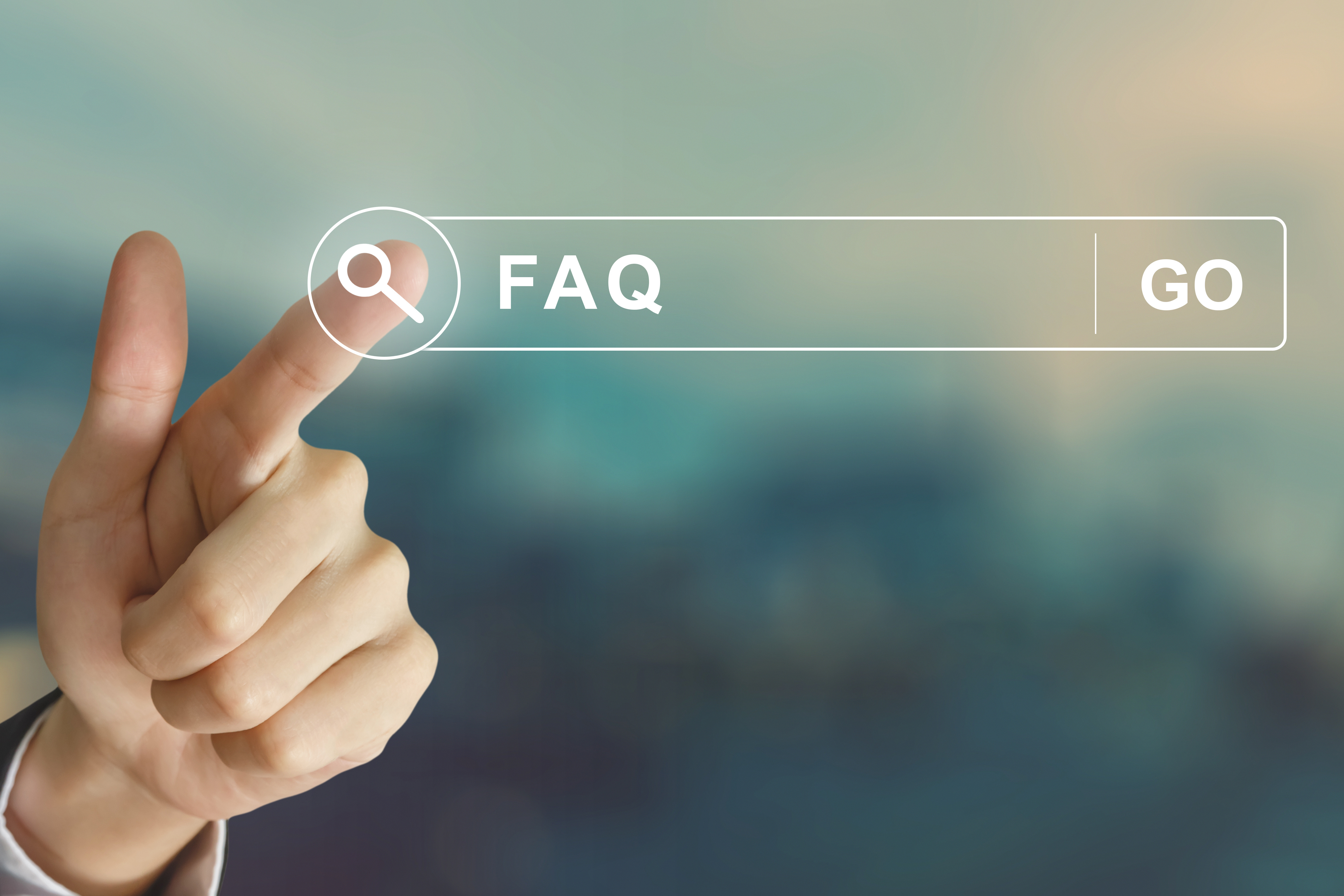 A hand pointing at a search bar with ‘FAQ’ written inside, symbolizing seeking answers or finding information through frequently asked questions.