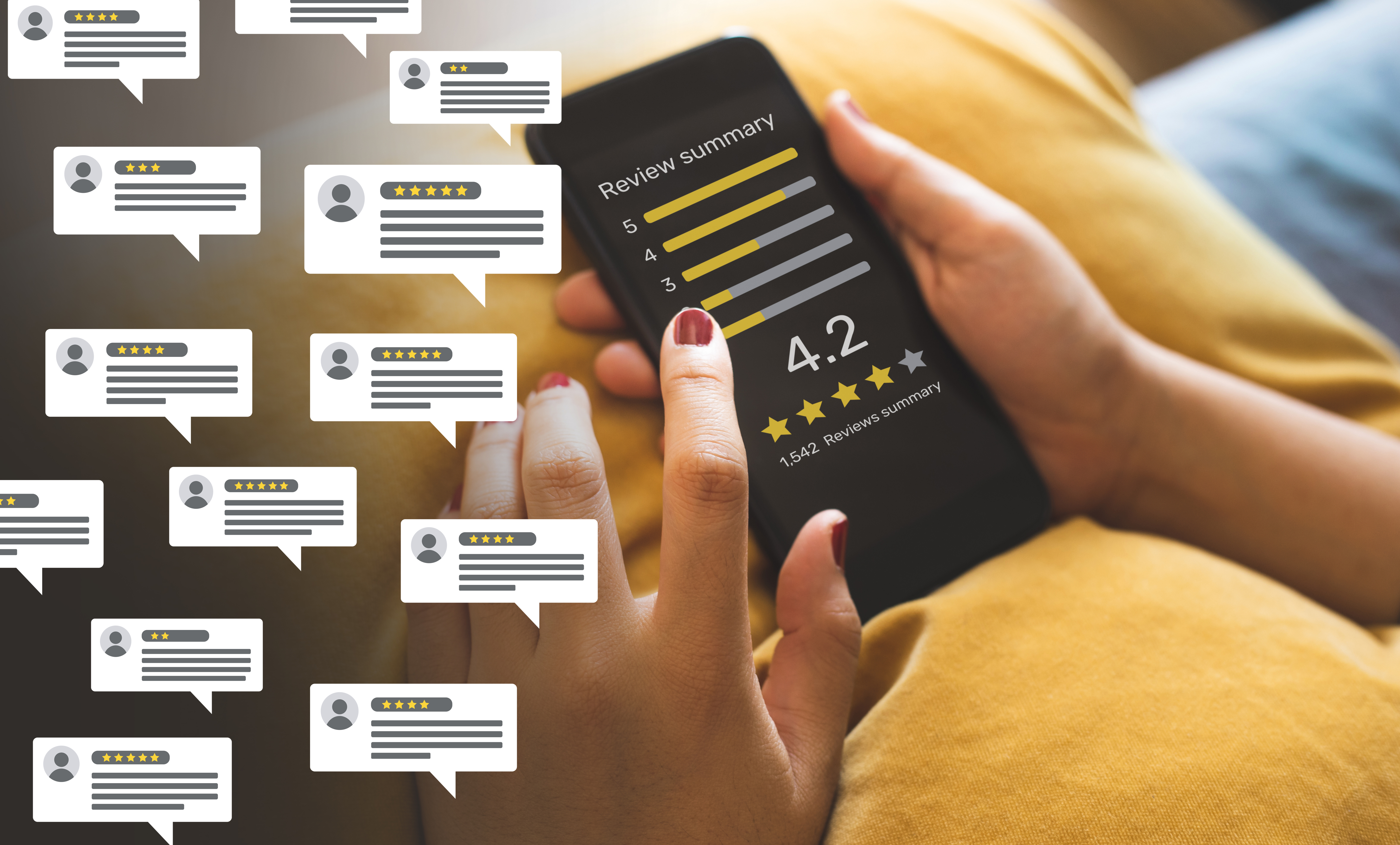 A hand is holding a smartphone displaying a review summary of 4.2 stars out of 5, based on 1,542 reviews. Speech bubbles with different star ratings represent customer feedback.